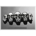 Insigne avec 5 crânes chromé